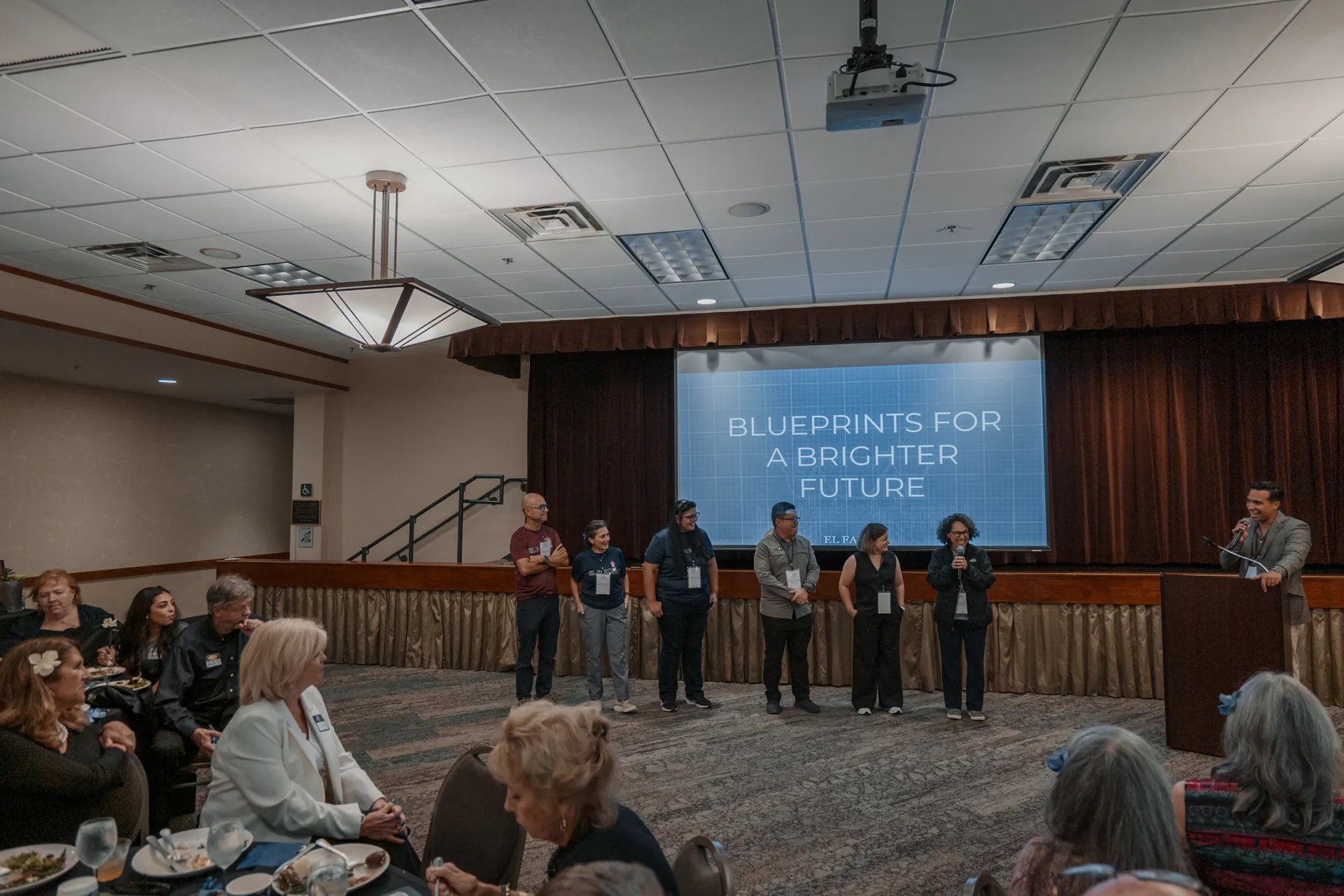 Supporters watch a program during an El Faro fundraising event.